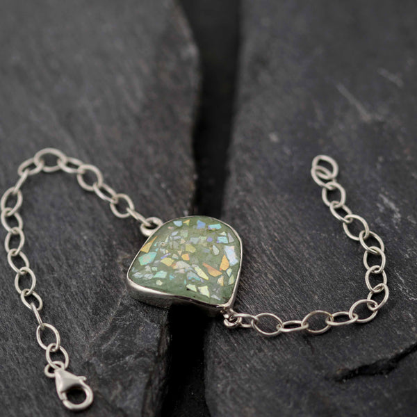 צמיד זכוכית רומית עתיקה מוקפת במסגרת מכסף 925 בעבודת יד